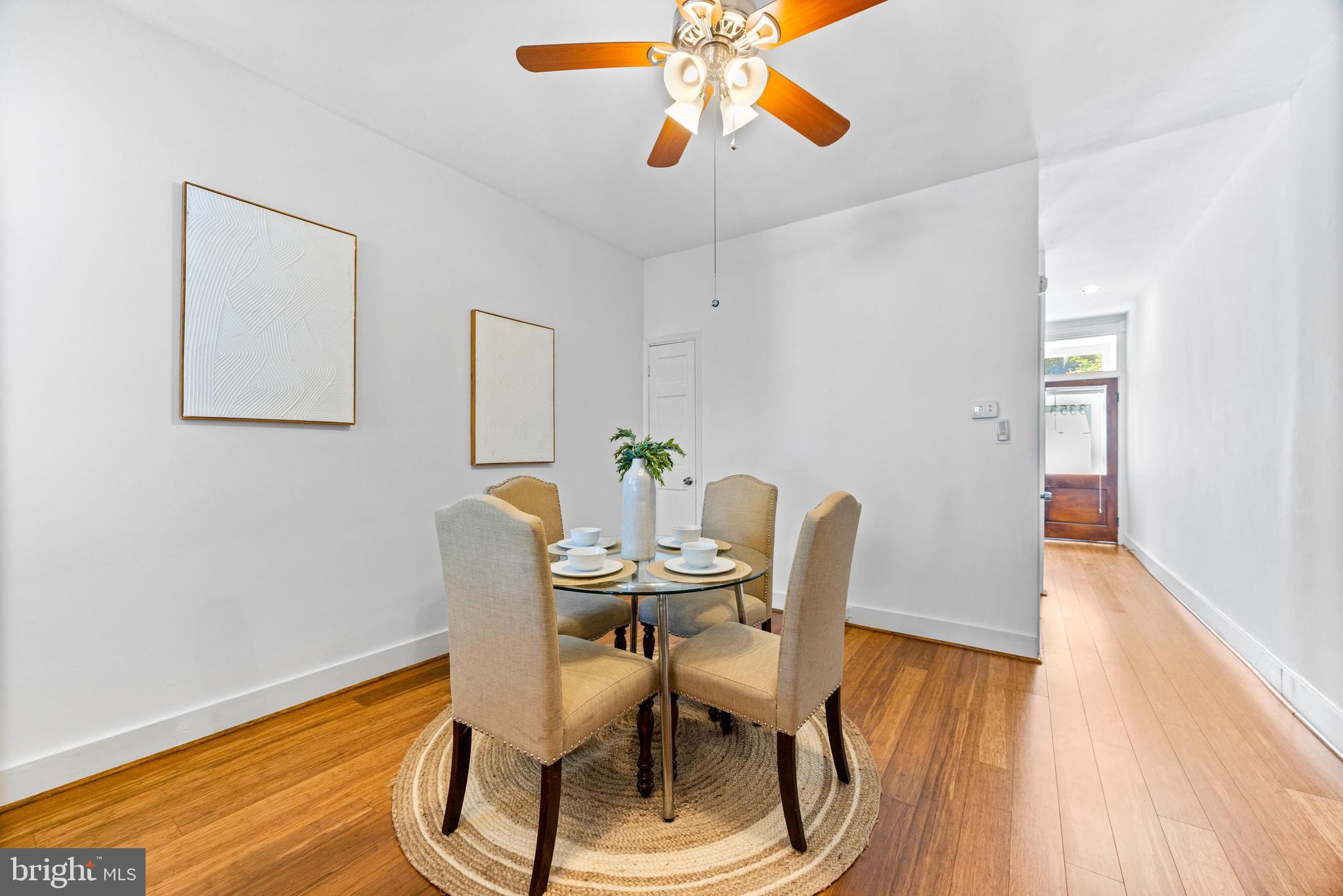 3353 Beech Avenue Baltimore, MD 21211 - Photo 10 of 32 a view of a dining room with furniture and wooden floor