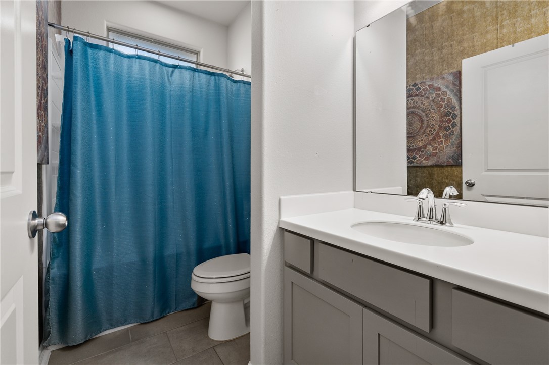 1031 Ocean Breeze Portland, TX 78374 - Photo 20 of 35 a bathroom with a sink a toilet and shower