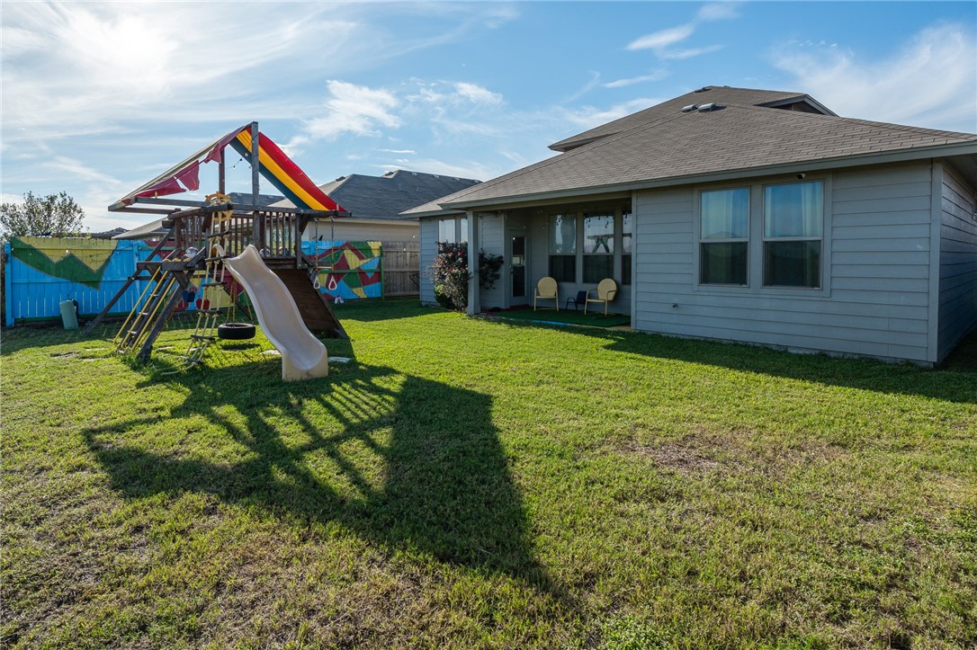 1031 Ocean Breeze Portland, TX 78374 - Photo 33 of 35 a view of a house with a yard and sitting area