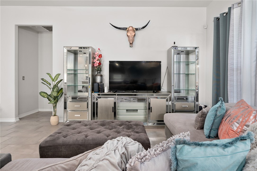 1031 Ocean Breeze Portland, TX 78374 - Photo 7 of 35 a living room with furniture and a flat screen tv