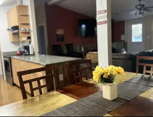 a bedroom with a bed couch and window