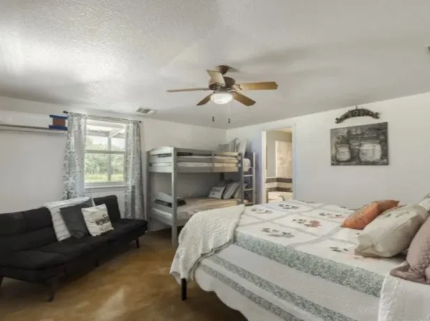 a bathroom with a tub a sink and a mirror