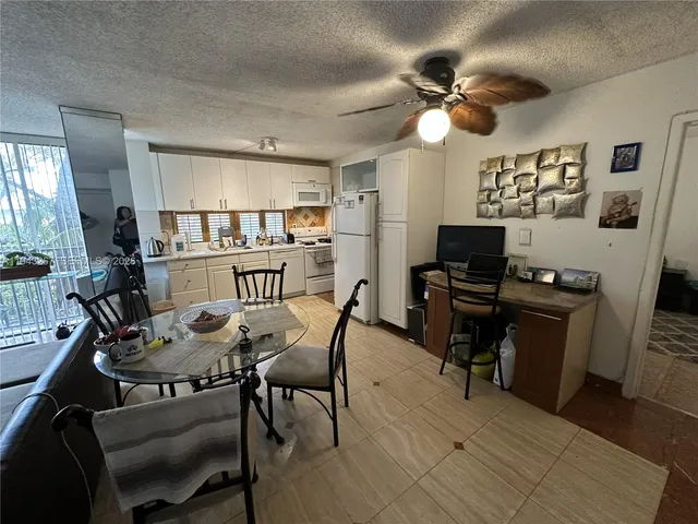 a view of a workspace with furniture and a livingroom