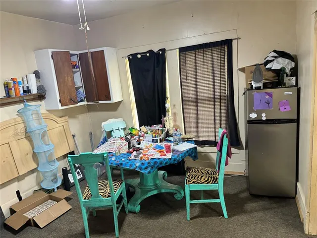 a dining room with furniture and window