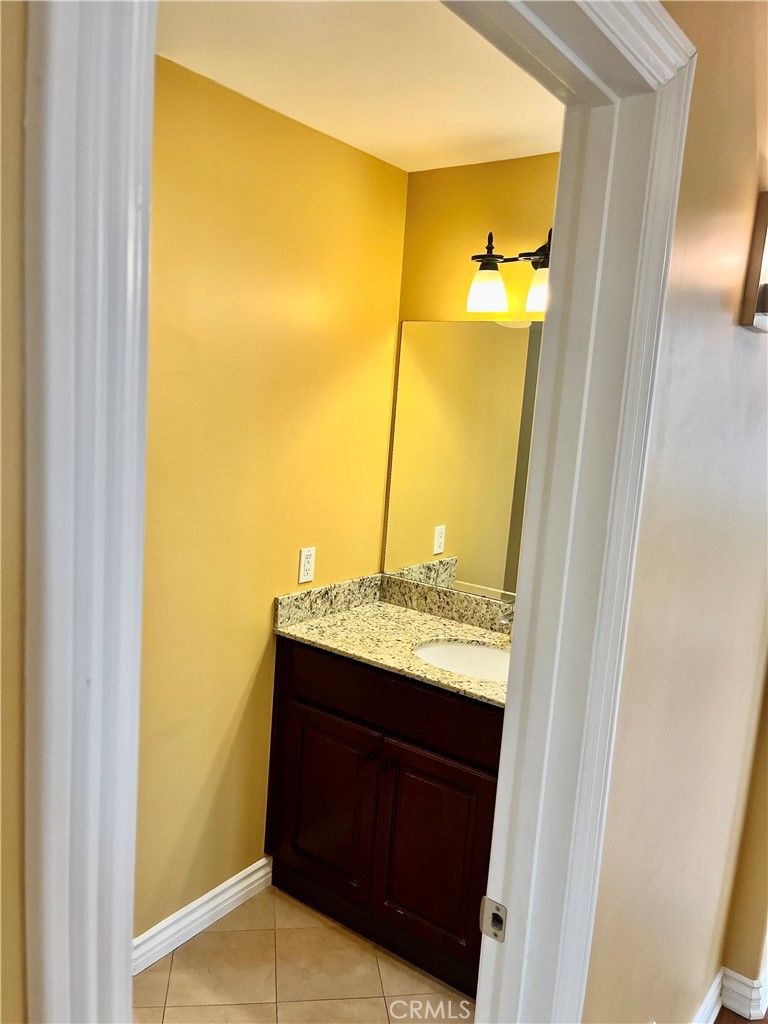244 Avenida Granada, Unit B San Clemente, CA 92672 - Photo 11 of 19 a bathroom with a sink and a mirror