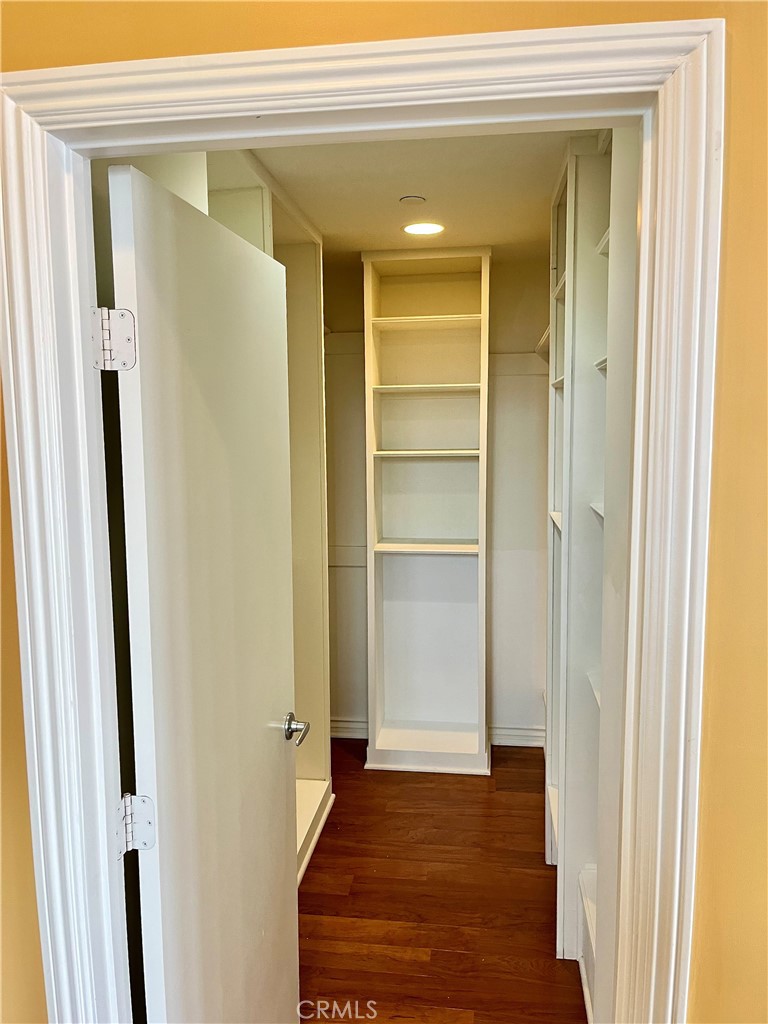 244 Avenida Granada, Unit B San Clemente, CA 92672 - Photo 16 of 19 a view of a hallway with wooden floor