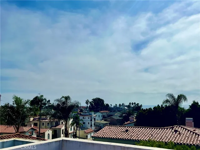 a view of city and trees in a city