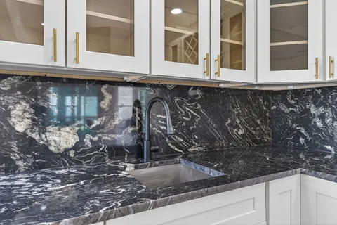 a view of an empty room with glass door