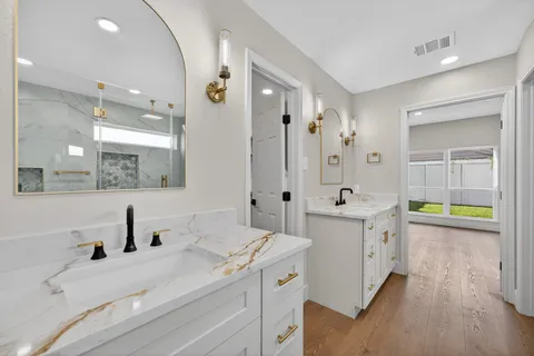 a bathroom with a bathtub and a shower