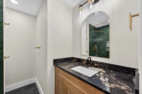 a picture of a bathroom with a shower