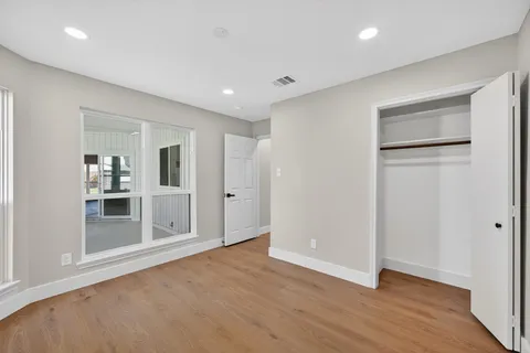 a large kitchen with a stove a sink and a refrigerator