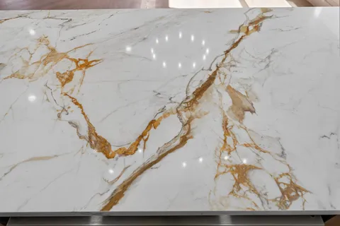 a view of a room with wooden floor ceiling fan and window