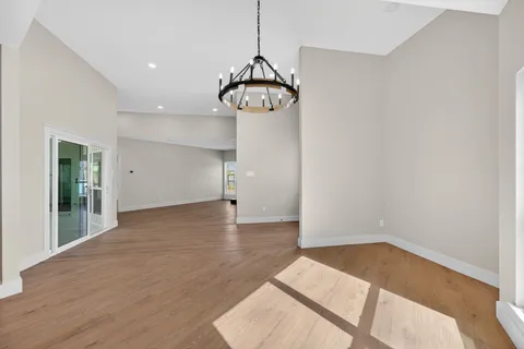 a view of a kitchen with stainless steel appliances refrigerator and cabinets