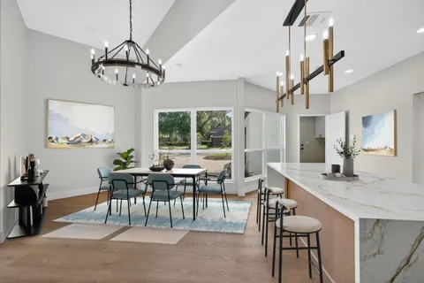 a view of an entryway with wooden floor and windows