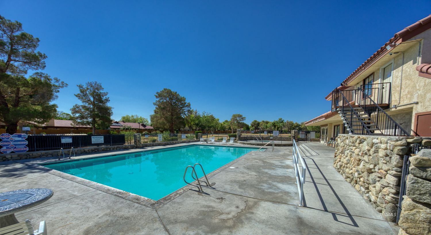 218 Washington Way Ridgecrest, CA 93555 - Photo 25 of 34 a view of a swimming pool with a patio
