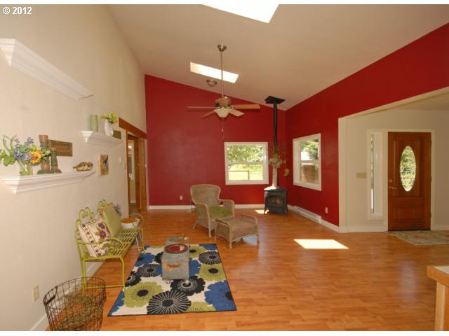 39604 Little Fall Creek Road Fall Creek, OR 97438 - Photo 3 of 8 a living room with furniture window and wooden floor