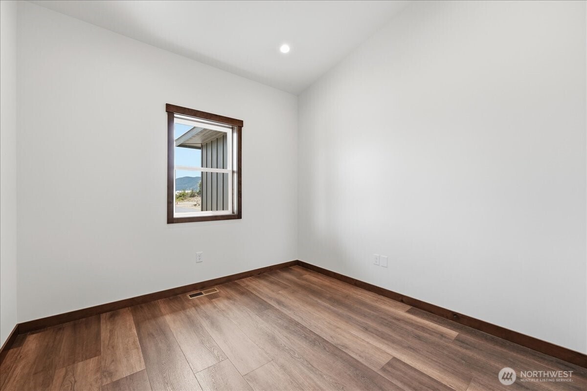 110 Slide View Lane Manson, WA 98831 - Photo 17 of 38 an empty room with a window