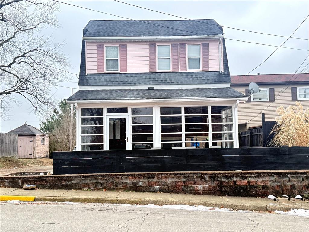 389 Webster Street Rochester, PA 15074 - Photo 24 of 24 a front view of a house with a yard