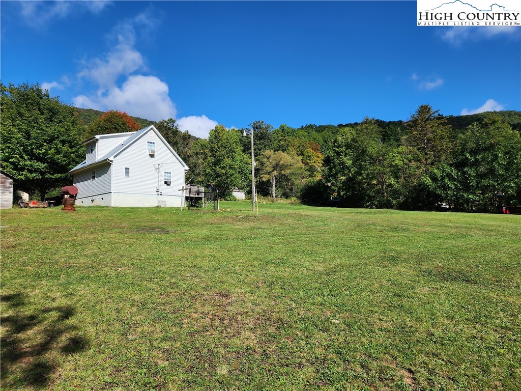 369 Ransey Woodring Road Todd, NC 28684 - Photo 5 of 6 a view of a house with a yard