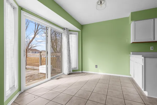 a view of an empty room with a fireplace