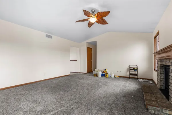 a view of an empty room with windows