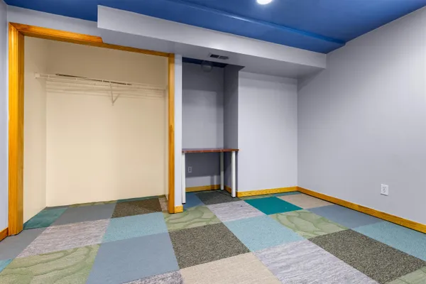 a room that has a rug and a wooden floor