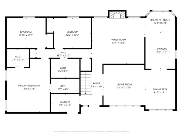 an empty room with windows and chandelier fan