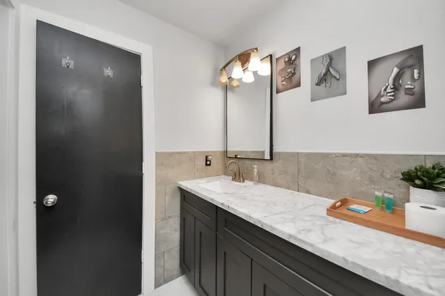 a bathroom with a sink and a mirror