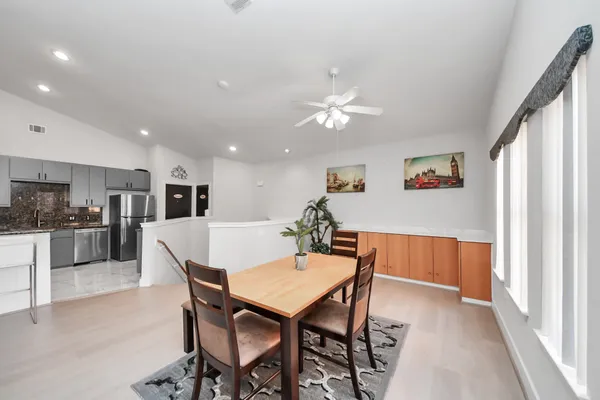 a view of a dining room with furniture and wooden floor