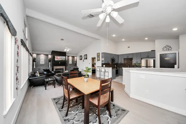 a living room with furniture and kitchen view