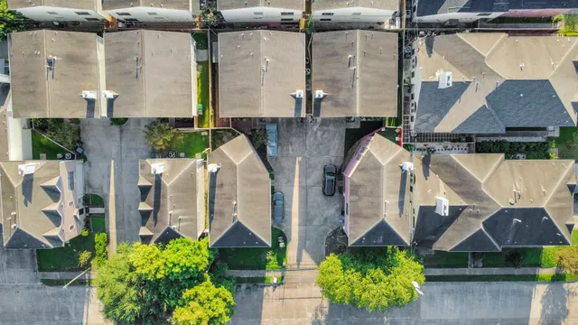 an aerial view of a house with a garden and a potted plant