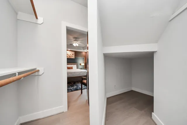 a view of utility room and bedroom