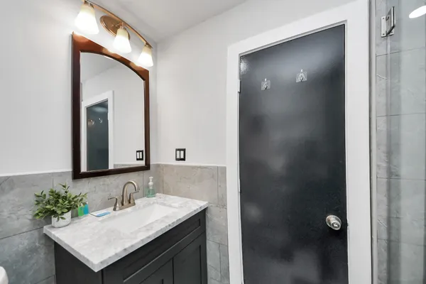 a bathroom with a sink and a mirror