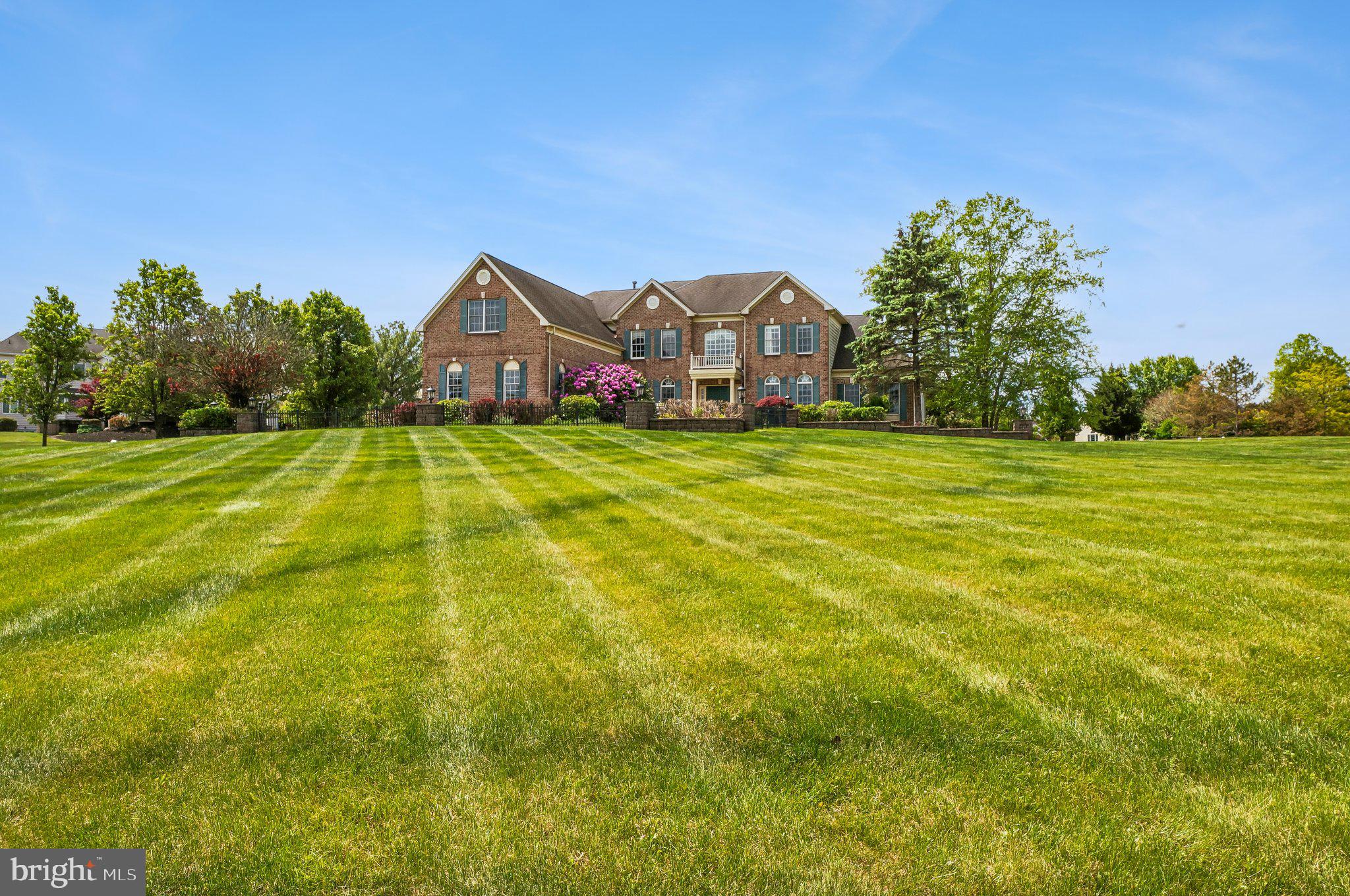 1 Baker Way Pennington, NJ 08534 - Photo 69 of 77 a front view of a house with a big yard