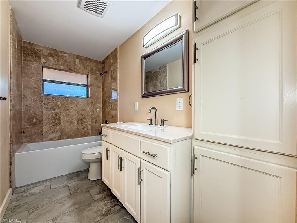 2115 St Croix Avenue Fort Myers, FL 33905 - Photo 21 of 37 Full bath with vanity and shower / bathtub combination