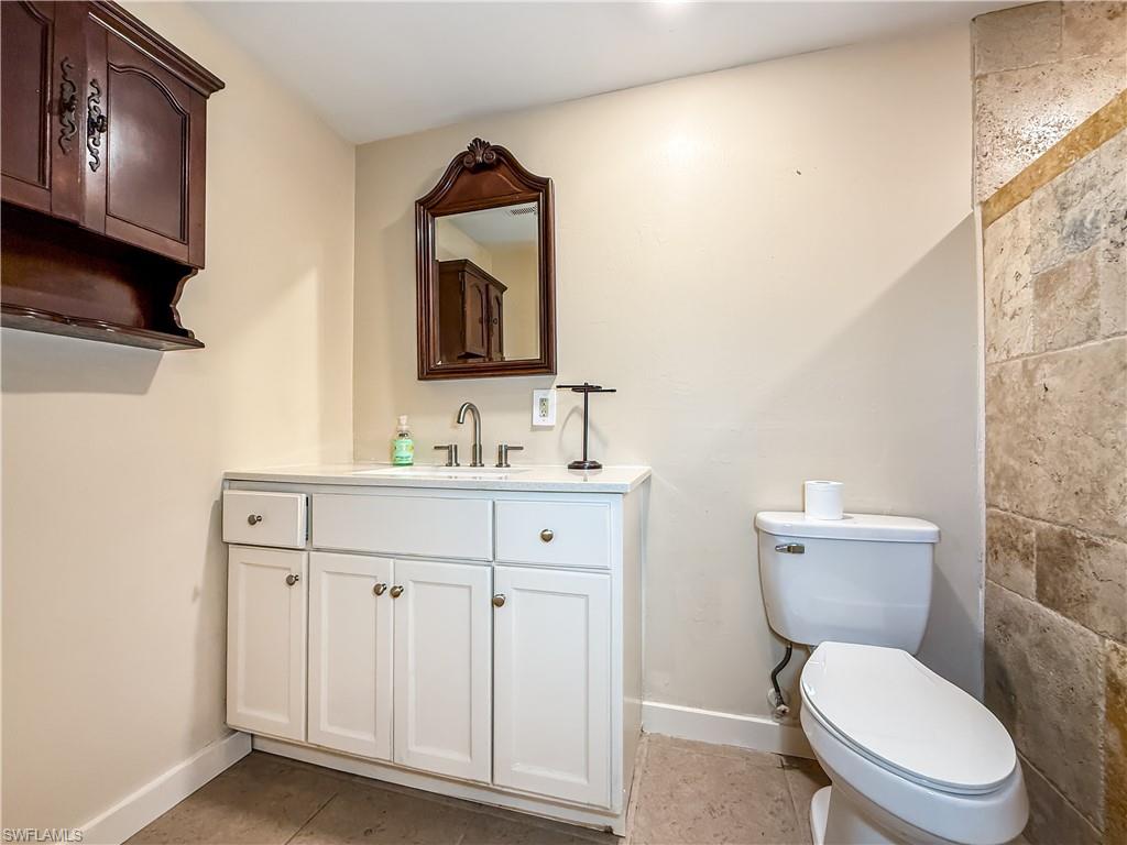 2115 St Croix Avenue Fort Myers, FL 33905 - Photo 24 of 37 Half bathroom with vanity and light tile patterned floors