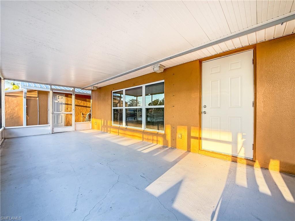 2115 St Croix Avenue Fort Myers, FL 33905 - Photo 28 of 37 Unfurnished sunroom featuring a patio