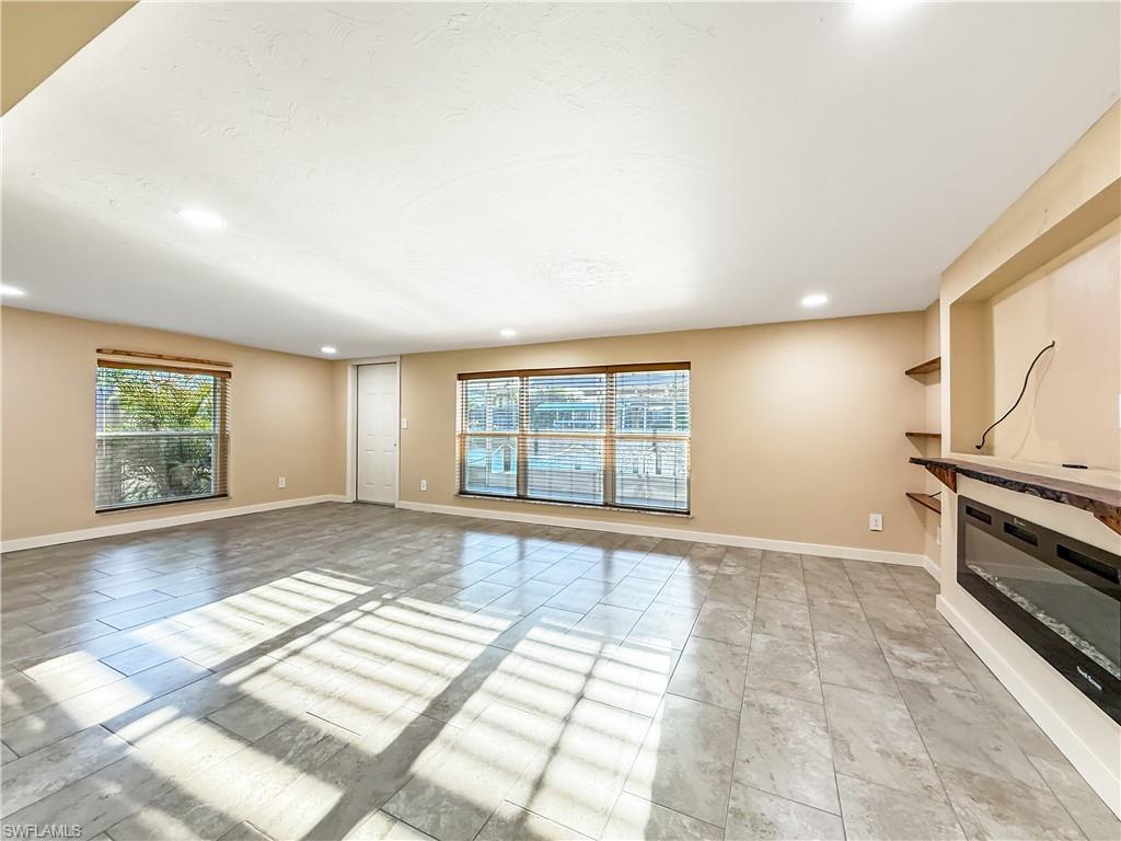 2115 St Croix Avenue Fort Myers, FL 33905 - Photo 5 of 37 Unfurnished living room with plenty of natural light