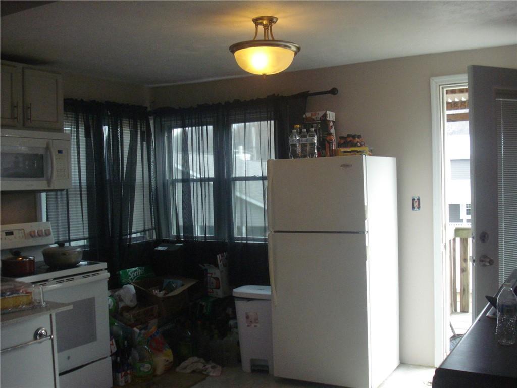 1119 Riverside Drive Beaver, PA 15009 - Photo 4 of 14 a refrigerator freezer sitting inside of a kitchen