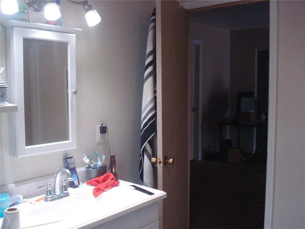 1119 Riverside Drive Beaver, PA 15009 - Photo 8 of 14 a bathroom with a sink vanity and a mirror