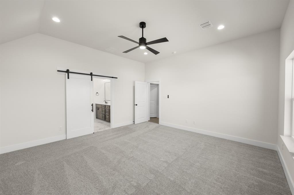 4867 Prairie Sky Lane DISH, TX 76247 - Photo 22 of 27 an empty room with closet and a ceiling fan