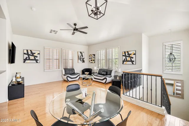 a living room with furniture a couch and a window