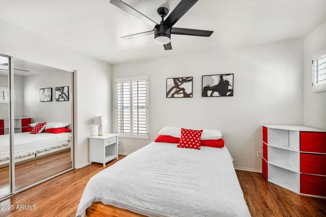 a bedroom with a bed and a dresser