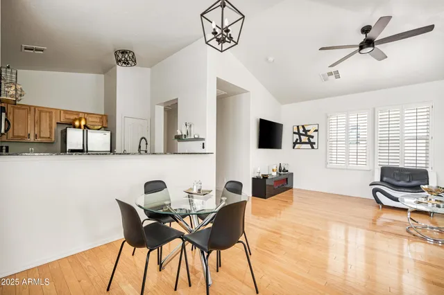 a view of a dining room with furniture and a window