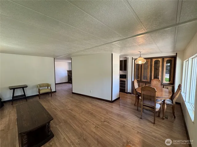 a living room with furniture and a chair