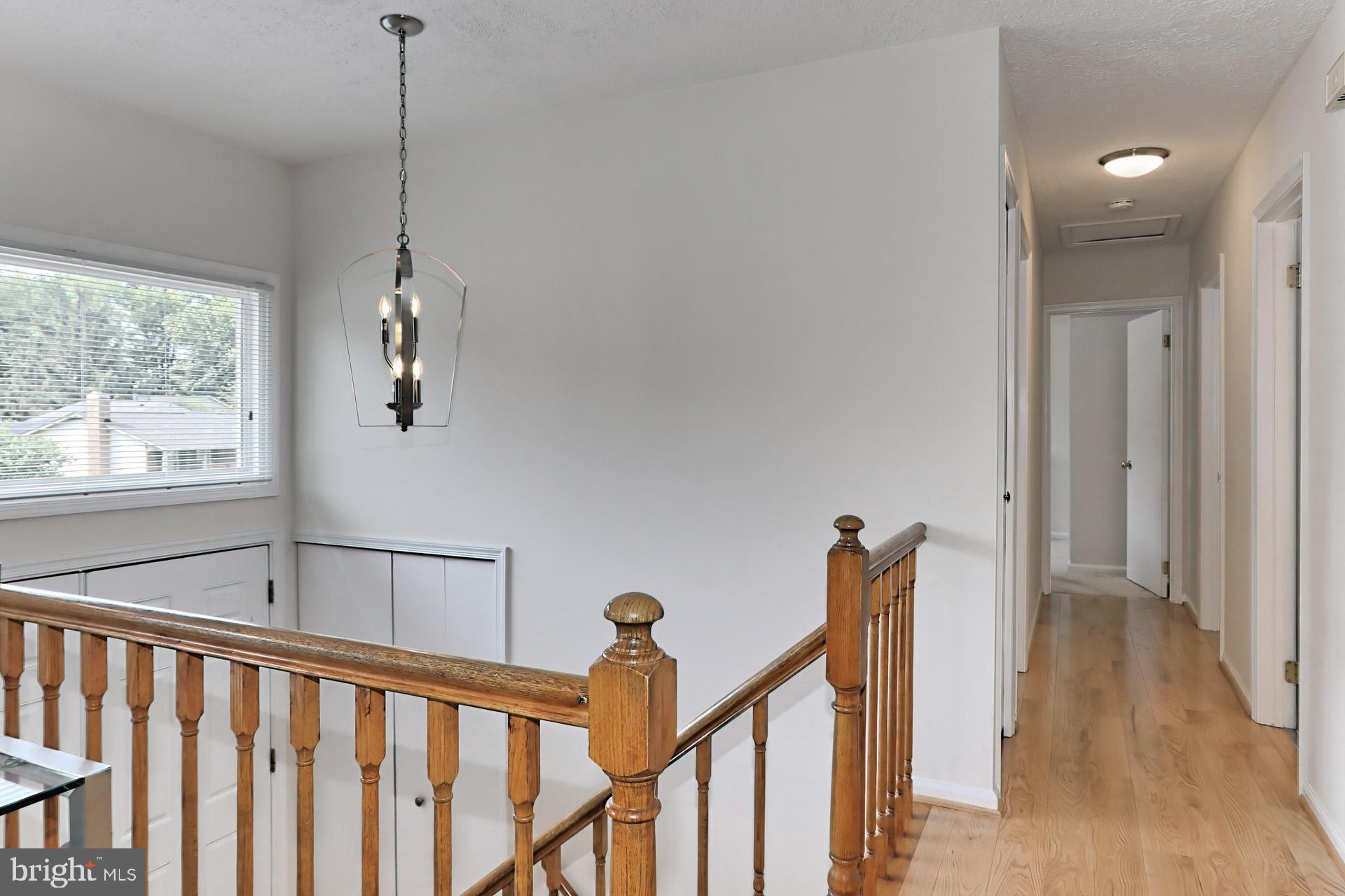 9110 Rockefeller Lane Springfield, VA 22153 - Photo 22 of 56 New hardwood floors down the hallway