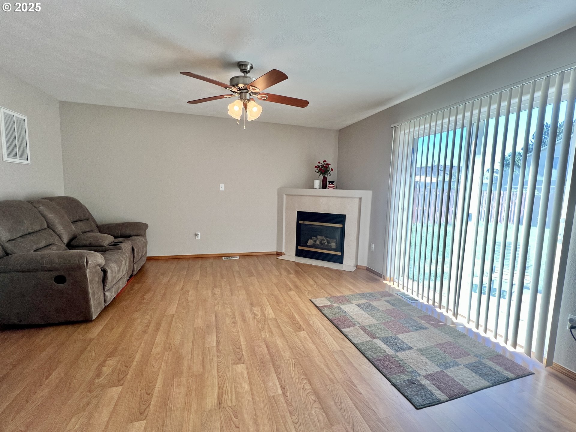 112 Northeast 11th Street Hermiston, OR 97838 - Photo 11 of 23 a living room with furniture and a fireplace