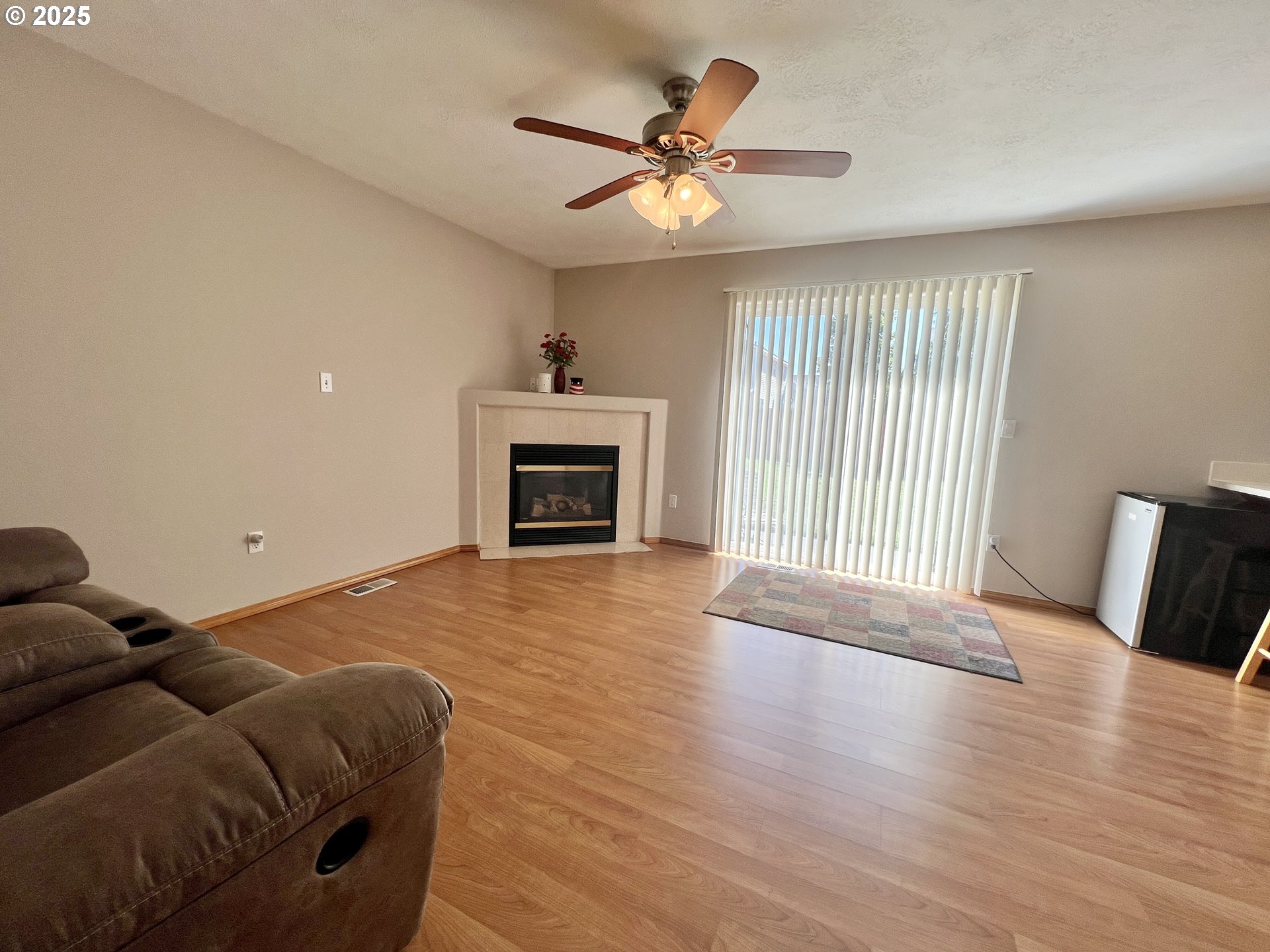 112 Northeast 11th Street Hermiston, OR 97838 - Photo 13 of 23 a living room with furniture and a fireplace