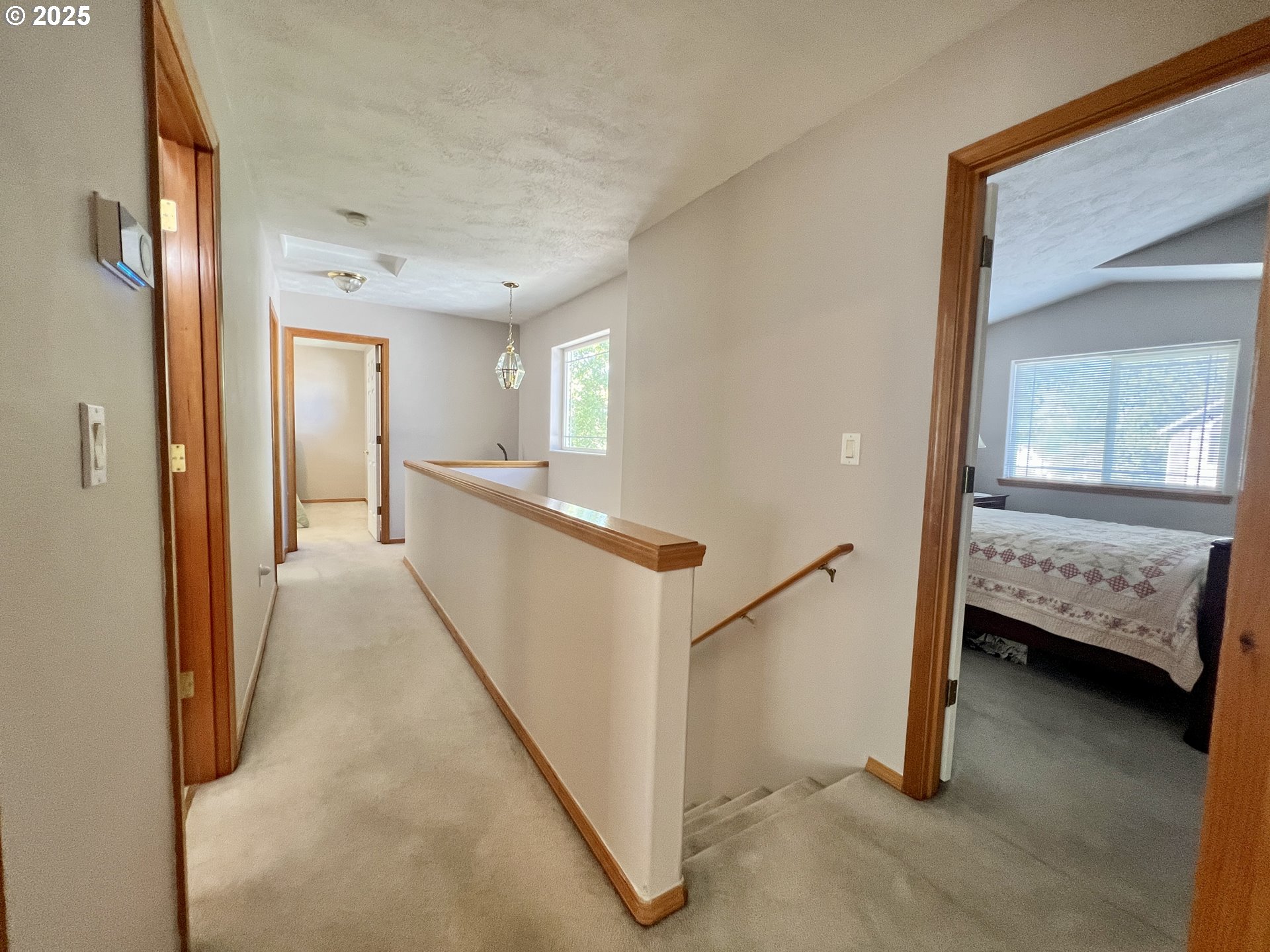 112 Northeast 11th Street Hermiston, OR 97838 - Photo 15 of 23 a view of a hallway with bedroom and stairs