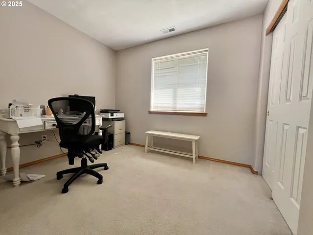 a view of a workspace with furniture